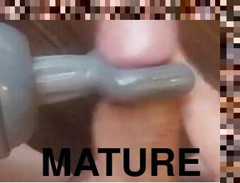 Shaved exhibitionist masturbator massaging cock with vibrator
