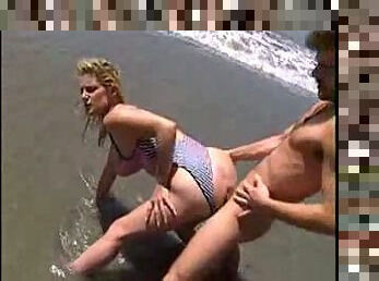 sally layd on the beach