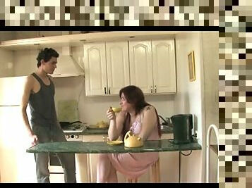 Milf has sex in the kitchen