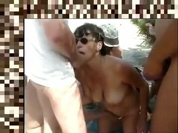 A French mature dogging Blowbang at the beach