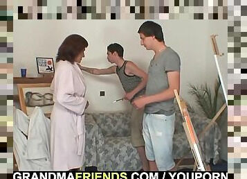 Two young painters bang granny